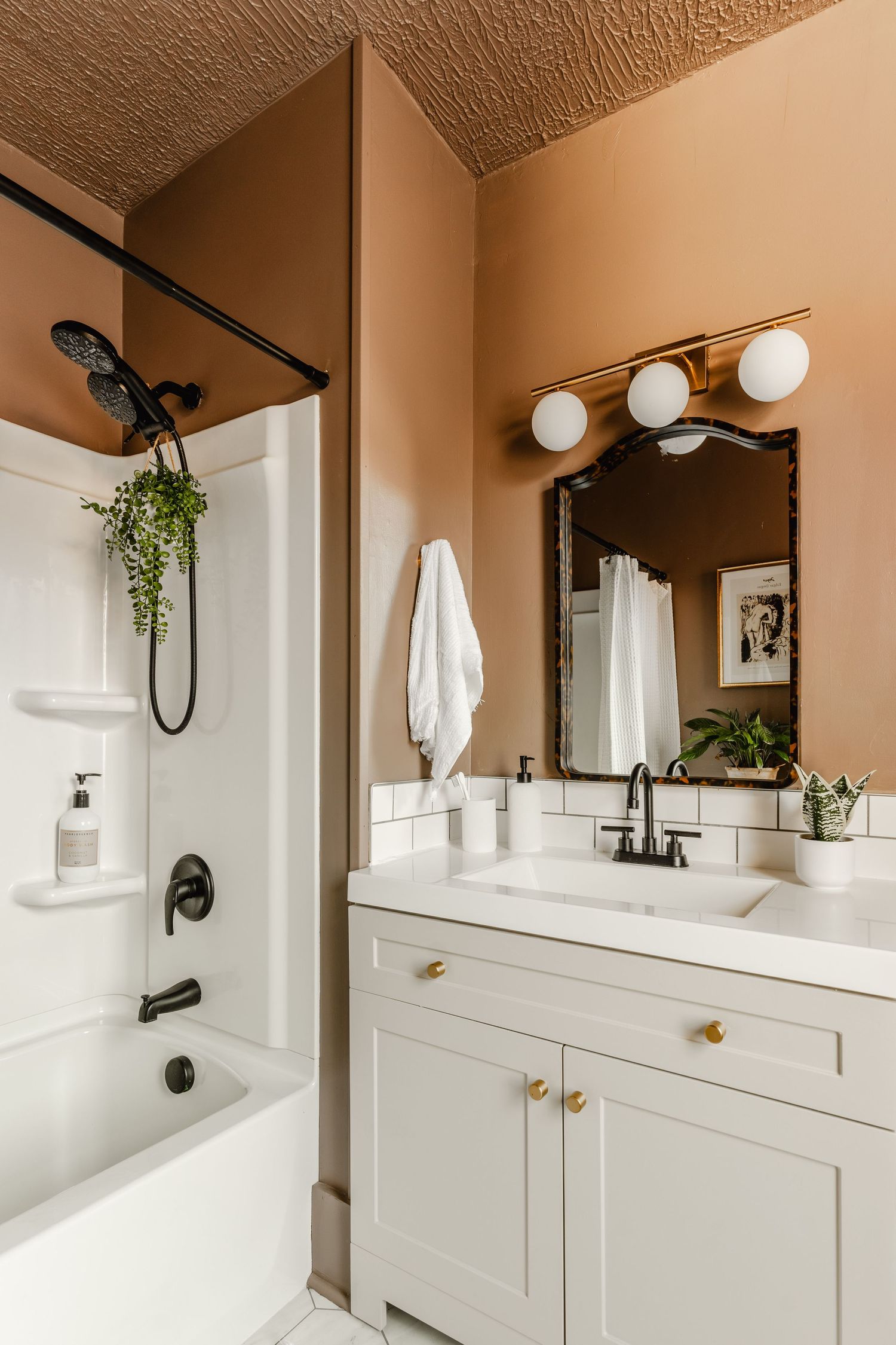Vertical format listing photo of remodeled bathroom
