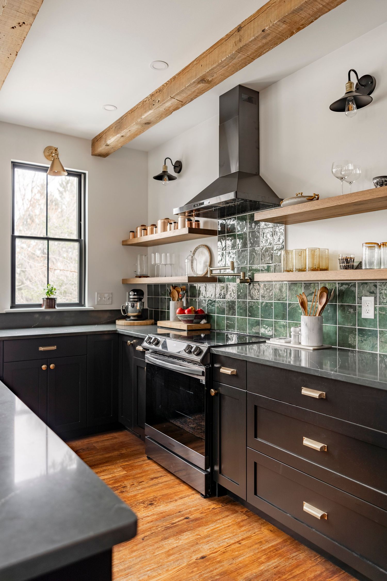 Range with matching hood vent captured by Nicole + James Co., interior design photographers.
