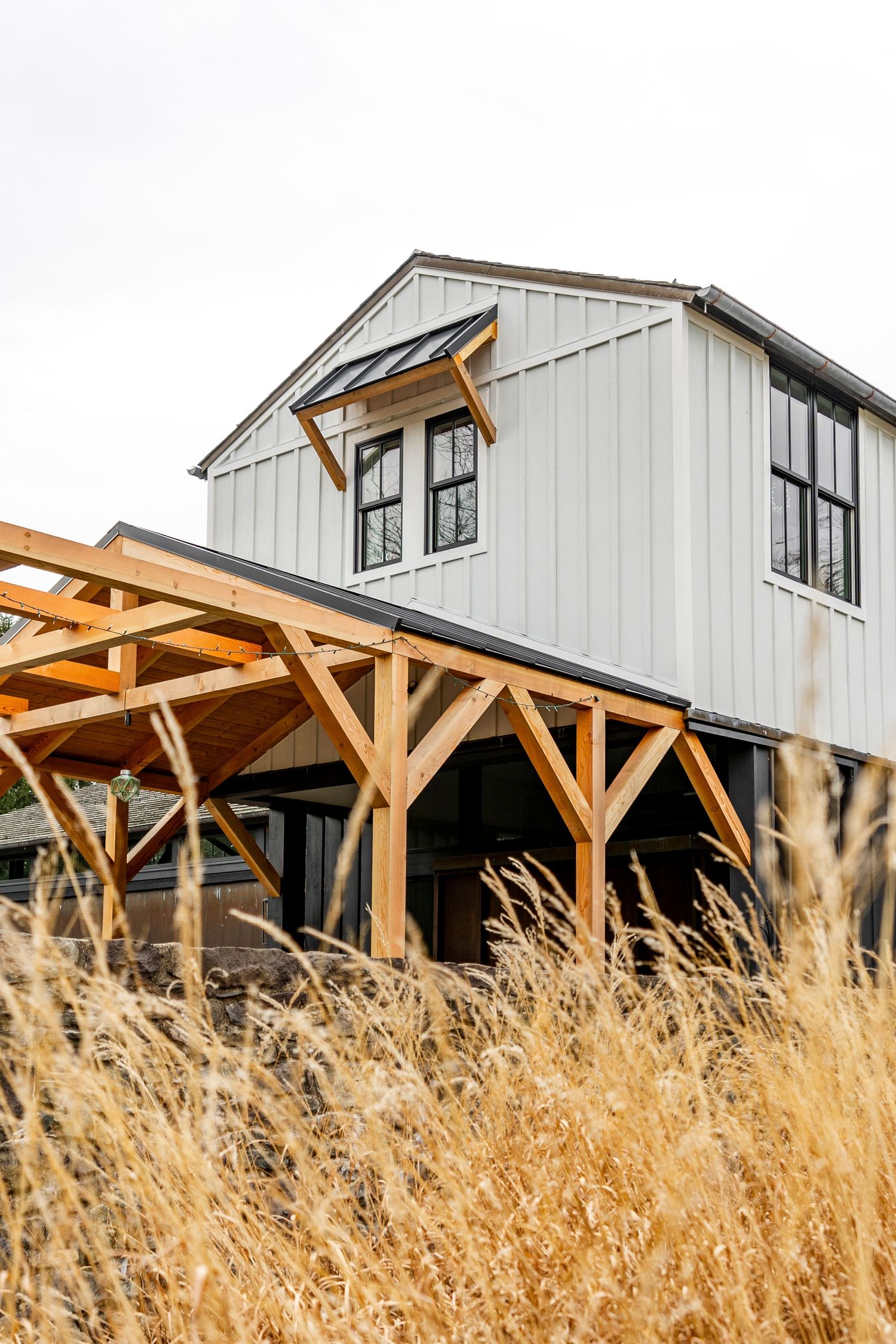 Timber frame covered patio photographed by Nicole + James Co., Construction Photographer in Central PA.