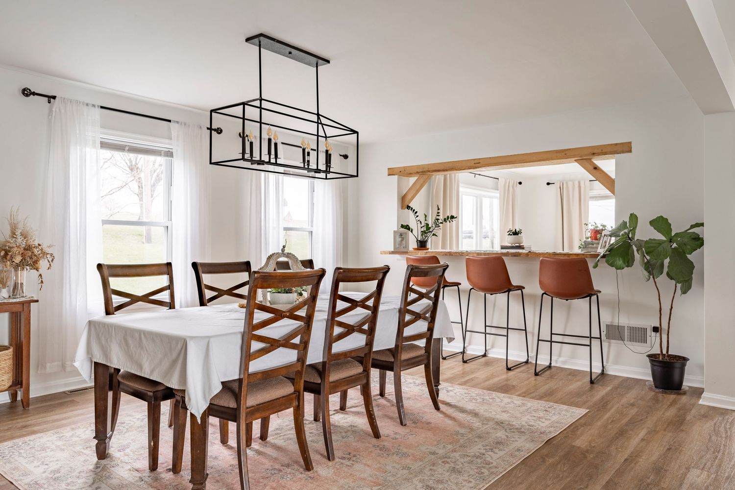 Minimalist designed dining room with candle chandelier