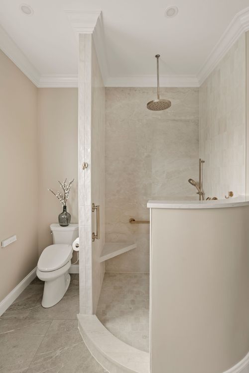 Marble corner shower shelf with a folded towel and bar of soap