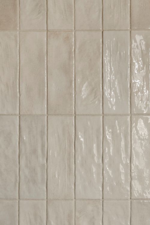 Close-up texture of glossy handmade ceramic wall tile