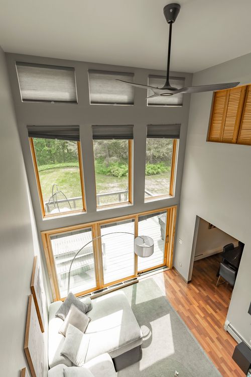 Third floor plan showing an open-to-below loft, bedroom, bath and walk-in closet