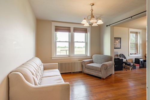 Home office with a desk, printer and window overlooking the yard