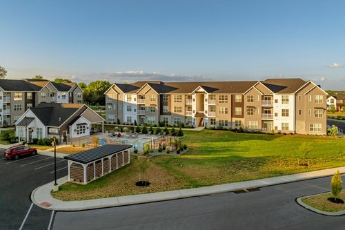 Aerial view of the pool clubhouse area and mail kiosk pavilion at dusk