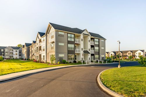 Street view of building 6000 with other apartment buildings in the distance