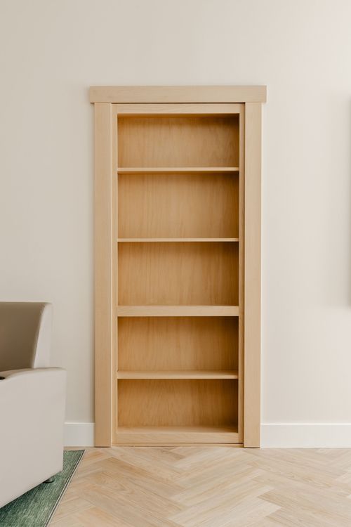 Close-up of an empty built-in wood bookcase