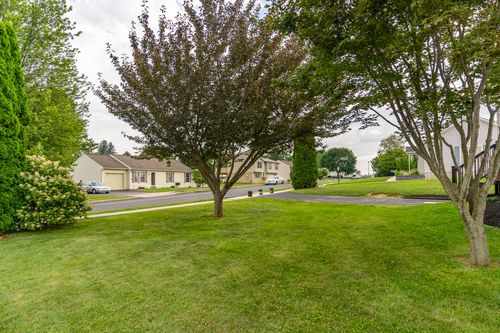 Front yard view across the street toward neighboring homes