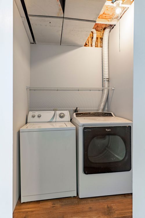 Laundry closet with a top-load washer and front-load dryer