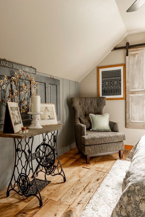 Reading nook with a vintage sewing-machine-base console table and a tufted armchair