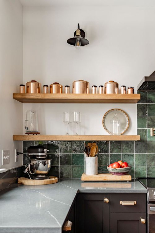 Kitchen corner with a copper canister shelf, stand mixer and marble countertop