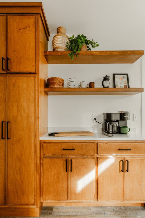 Coffee station with floating wood shelves, a potted plant and Keurig maker